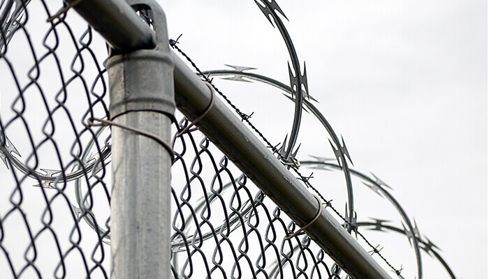 Chain Link Fence with Razor Wire Protection Chain Link Fence with Razor Wire Protection